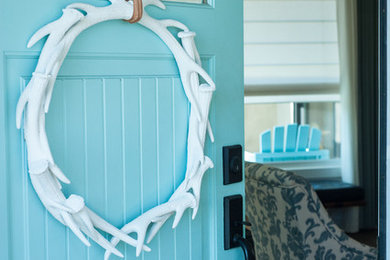Single front door - coastal single front door idea in Los Angeles with white walls