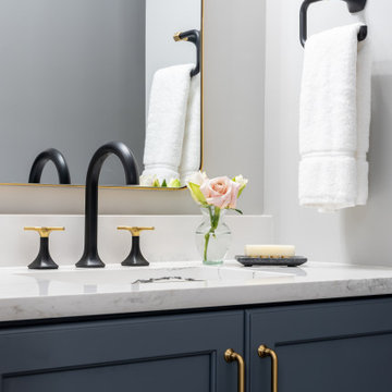 A curated bathroom with clever storage and intricate, artful design