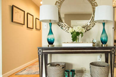 Inspiration for a transitional medium tone wood floor entryway remodel in Boston with beige walls