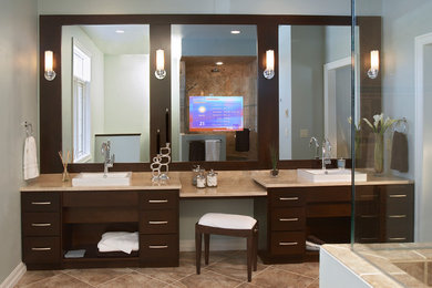 Design ideas for a mid-sized contemporary master bathroom in Other with flat-panel cabinets, dark wood cabinets, beige tile, an alcove shower, stone tile, grey walls, ceramic floors, a drop-in sink, granite benchtops, brown floor and a hinged shower door.