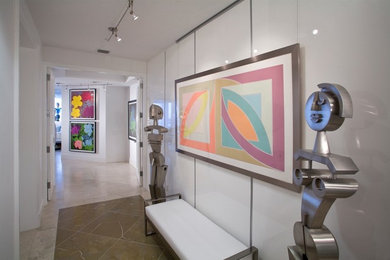 Hallway - large modern marble floor hallway idea in Miami