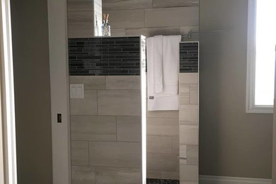 Medium sized traditional ensuite bathroom in Other with shaker cabinets, black cabinets, multi-coloured tiles, matchstick tiles, grey walls, vinyl flooring, a submerged sink, marble worktops and an alcove shower.