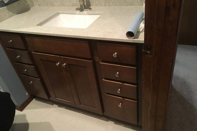 Inspiration for a mid-sized contemporary master single-sink bathroom remodel in Portland with shaker cabinets, dark wood cabinets, granite countertops and a built-in vanity