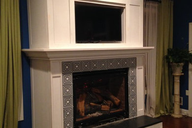 Photo of an arts and crafts family room in New York with a standard fireplace and a concealed tv.