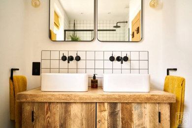 Bold black accessories and tiles with contrasting yellow accents - Sussex