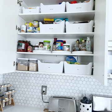 After: Labeled Bins and Turntables for a Tidy Pantry