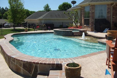 Example of a large minimalist backyard custom-shaped natural hot tub design in Dallas