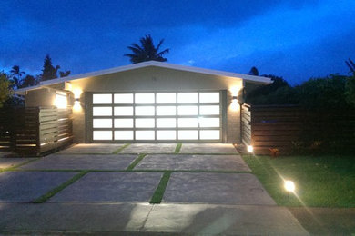 Mid-sized transitional attached two-car garage photo in Hawaii