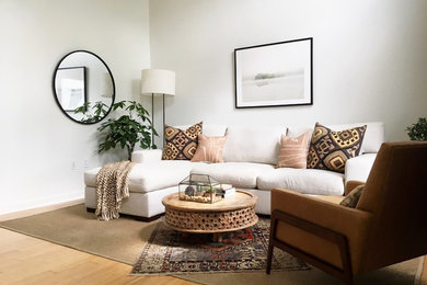 Example of an eclectic bamboo floor living room design in Austin with white walls