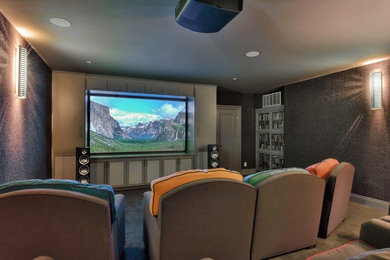 Example of a trendy home theater design in San Francisco with a projector screen