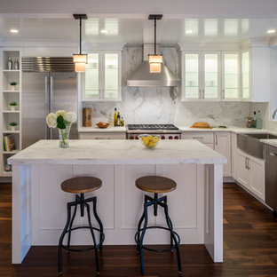 Mid-sized transitional kitchen pantry designs - Kitchen pantry - mid-sized transitional u-shaped dark wood floor kitchen pantry idea in Burlington with a farmhouse sink, shaker cabinets, white cabinets, marble countertops, stone slab backsplash, stainless steel appliances and an island