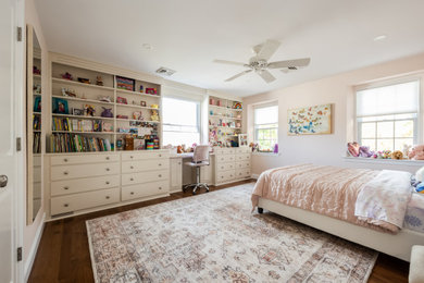Inspiration for a transitional girl dark wood floor kids' bedroom remodel in Philadelphia with pink walls