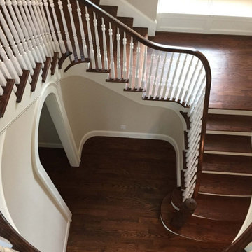 Circular Staircase with a Red Oak Stair Handrail and Pin Top Balusters