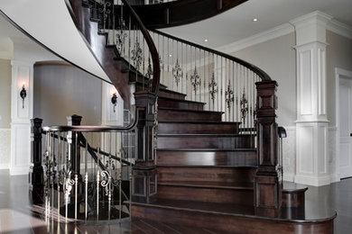 Design ideas for a large traditional wood spiral staircase in Other with wood risers.