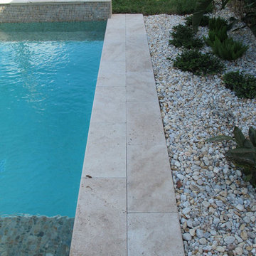 Ivory Tumbled Travertine Pavers and Pool Coping