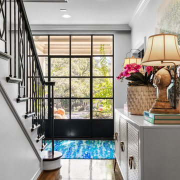 Vibrant Eclectic Entryway with Bold Staircase Runner and Artistic Accents