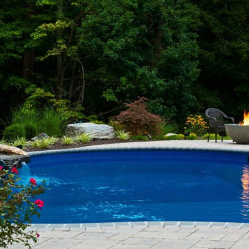Vinyl pool with Waterfall, Landscape Lighting and Landscaping