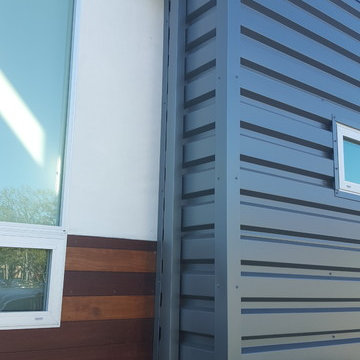 24 Gauge Steel, Collector Box and Downspout on Matching Wall Panels.