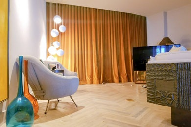 Large contemporary guest bedroom in Miami with white walls and dark hardwood floors.