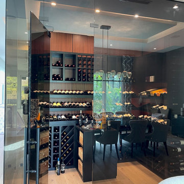 Black-Stained Wine Racking Design with Elegant Glass Wine Cellar Door