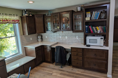 Inspiration for a mid-sized modern l-shaped eat-in kitchen remodel in Other with quartz countertops