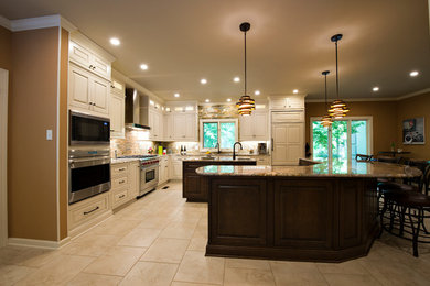 Huge transitional l-shaped porcelain tile eat-in kitchen photo in Little Rock with an undermount sink, raised-panel cabinets, white cabinets, granite countertops, stone tile backsplash, stainless steel appliances and two islands