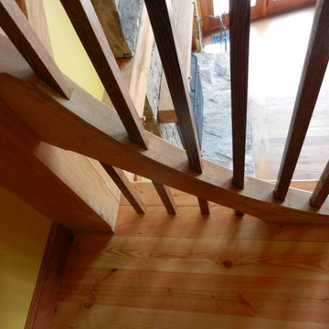Stair rail posts in frame brace