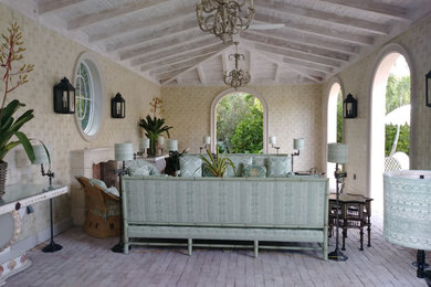 Example of a huge tuscan backyard patio design in Other
