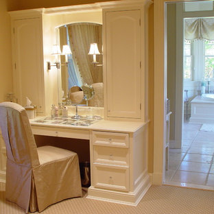 Closet - traditional women's carpeted closet idea in New York with white cabinets