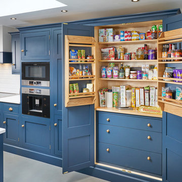 Feature larder unit in luxurious blue kitchen in Rothley, Leicestershire
