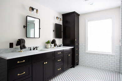 Mid-sized transitional master white tile and ceramic tile white floor, double-sink and mosaic tile floor bathroom photo in Columbus with shaker cabinets, black cabinets, white walls, an undermount sink, marble countertops, white countertops and a built-in vanity