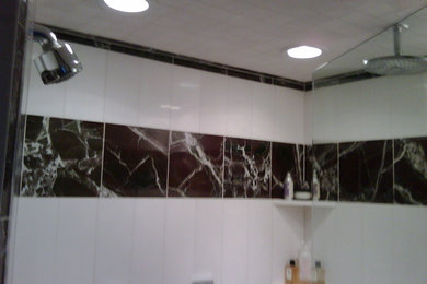 Inspiration for a huge modern master multicolored tile and marble tile marble floor and multicolored floor bathroom remodel in Houston with a one-piece toilet, multicolored walls, a trough sink and a hinged shower door