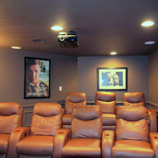 Medium sized classic enclosed home cinema in Providence with brown walls, carpet and a projector screen.