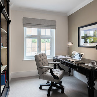 Design ideas for a medium sized modern study in Cheshire with multi-coloured walls, carpet, no fireplace, a freestanding desk and beige floors.