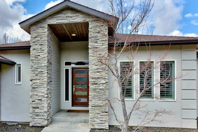 Example of a transitional exterior home design in Boise