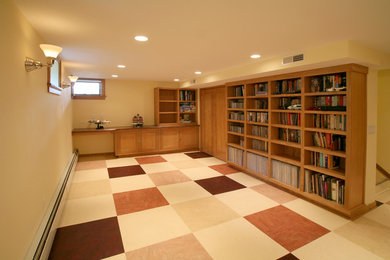 Photo of a mid-sized eclectic look-out basement in Other with beige walls and linoleum floors.