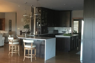Inspiration for a large modern eat-in kitchen remodel in Other with a farmhouse sink, quartz countertops, an island and multicolored countertops