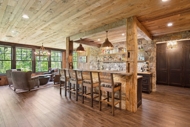 Example of a mountain style home bar design in Minneapolis