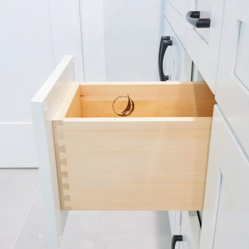 Modern White Shaker Eco-Friendly Bathroom Remodel with Black Quartz Countertop