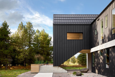 Example of a minimalist exterior home design in Other