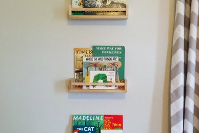 Inspiration for a small modern kids' room remodel in New York with gray walls