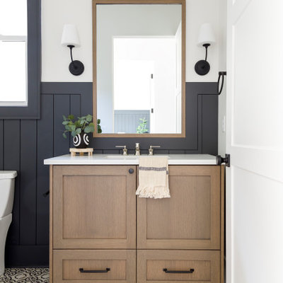 Small country kids' porcelain tile cement tile floor, single-sink and shiplap wall bathroom photo in Boise with flat-panel cabinets, medium tone wood cabinets, white walls, an undermount sink, quartz countertops, white countertops and a freestanding vanity
