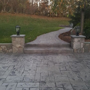 T-Stamped concrete patio, flagstone wall with columns
