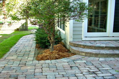 Patio - mid-sized backyard concrete paver patio idea in Kansas City with no cover