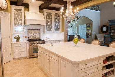 Inspiration for a mid-sized farmhouse l-shaped porcelain tile and beige floor eat-in kitchen remodel in Other with an undermount sink, recessed-panel cabinets, white cabinets, quartz countertops, white backsplash, ceramic backsplash, stainless steel appliances and an island