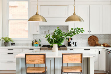Mid-sized trendy l-shaped eat-in kitchen photo in Other with shaker cabinets, white cabinets, quartzite countertops, an island and white countertops