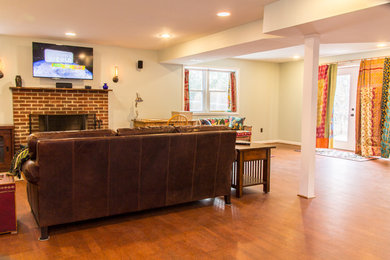 Mid-sized transitional brown floor family room photo in DC Metro with a standard fireplace and a brick fireplace