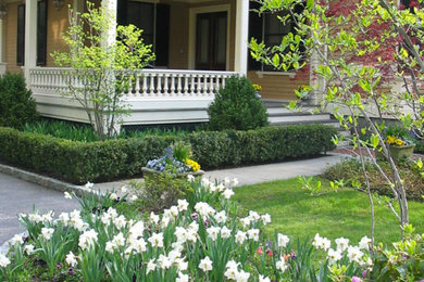 Design ideas for a mid-sized traditional full sun backyard stone landscaping in Boston.