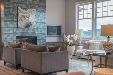 Inspiration for a mid-sized transitional formal open concept living room in San Francisco with beige walls, medium hardwood floors, a standard fireplace, a tile fireplace surround, a wall-mounted tv and brown floor.