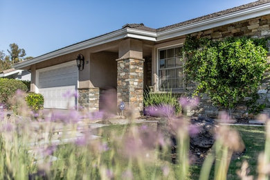 Mid-sized two-storey brick beige exterior in Orange County.